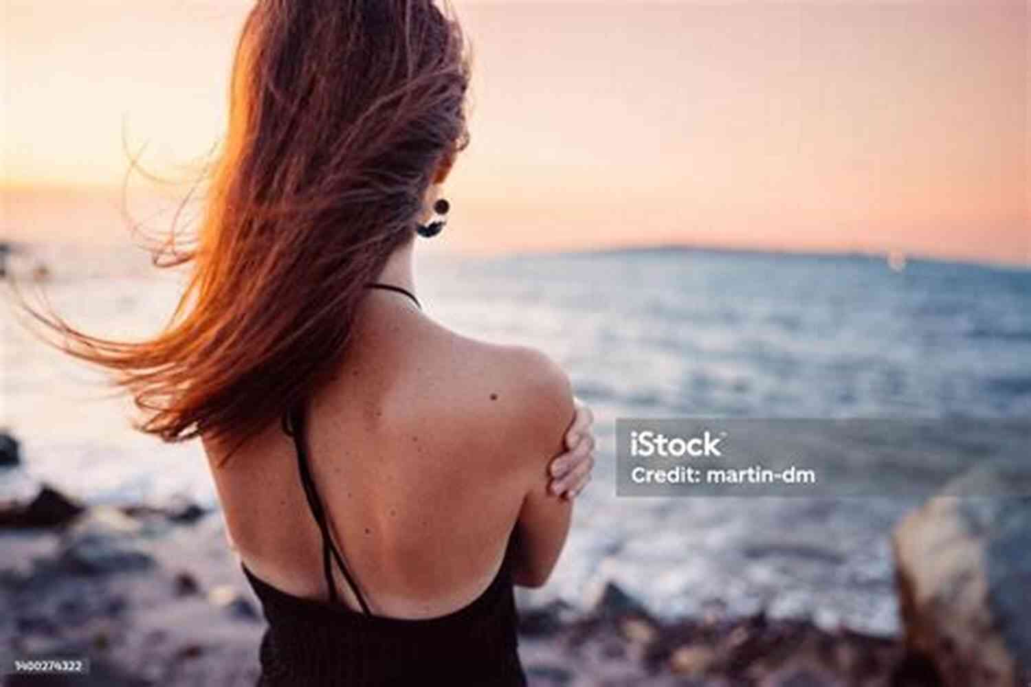 Woman Staring At The Sunset With A Mix Of Sadness And Longing In Her Eyes Bittersweet: How Sorrow And Longing Make Us Whole